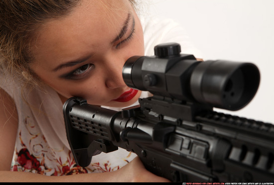 Woman Young Average Fighting with submachine gun Kneeling poses Casual Asian