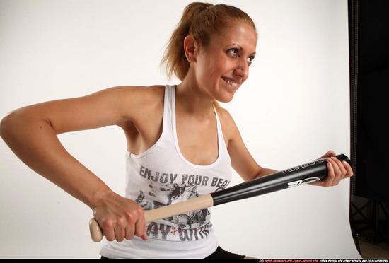 Woman Adult Athletic White Sitting poses Casual Fighting with bat