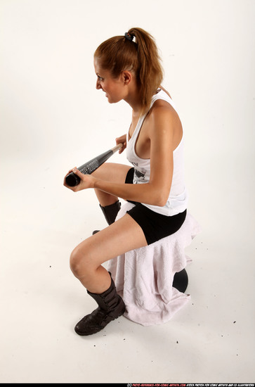 Woman Adult Athletic White Sitting poses Casual Fighting with bat