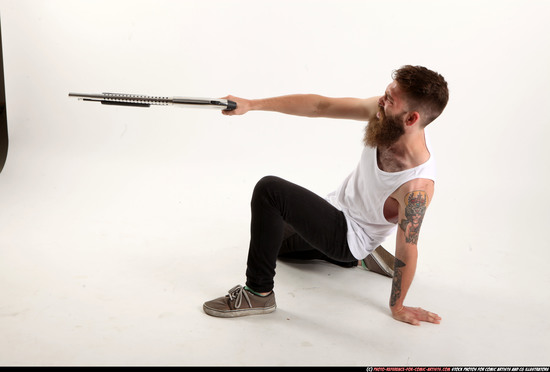 Man Adult Athletic White Kneeling poses Casual Fighting with shotgun