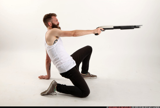 Man Adult Athletic White Kneeling poses Casual Fighting with shotgun