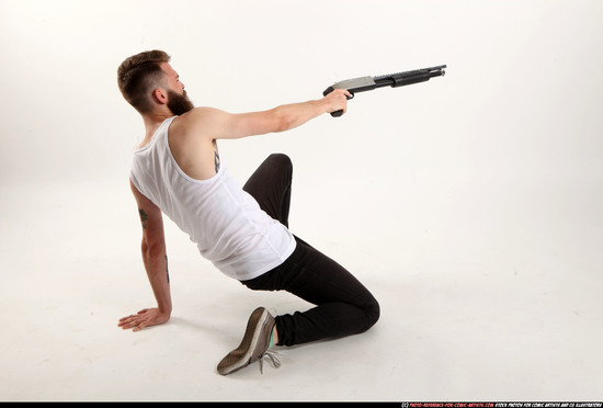 Man Adult Athletic White Kneeling poses Casual Fighting with shotgun