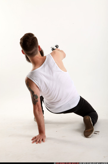 Man Adult Athletic White Kneeling poses Casual Fighting with shotgun