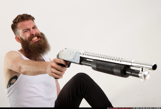 Man Adult Athletic White Kneeling poses Casual Fighting with shotgun