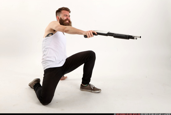 Man Adult Athletic White Kneeling poses Casual Fighting with shotgun