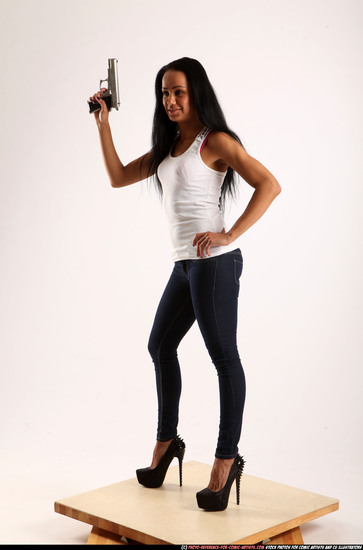 Woman Young Athletic Fighting with gun Standing poses Casual Latino