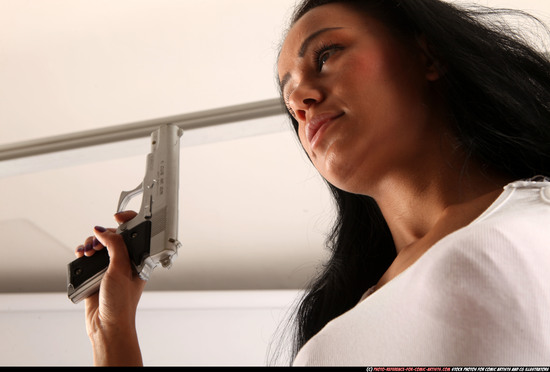 Woman Young Athletic Fighting with gun Standing poses Casual Latino