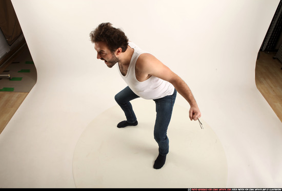 Man Adult Average White Fist fight Kneeling poses Casual