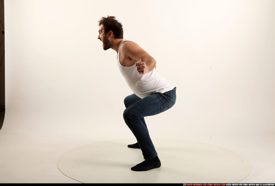 Man Adult Average White Fist fight Kneeling poses Casual