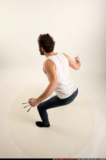 Man Adult Average White Fist fight Kneeling poses Casual