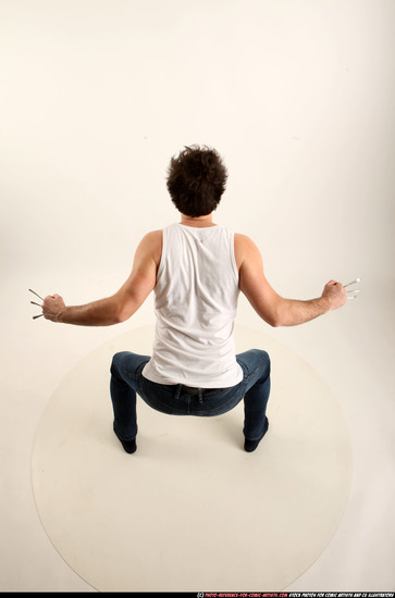 Man Adult Average White Fist fight Kneeling poses Casual