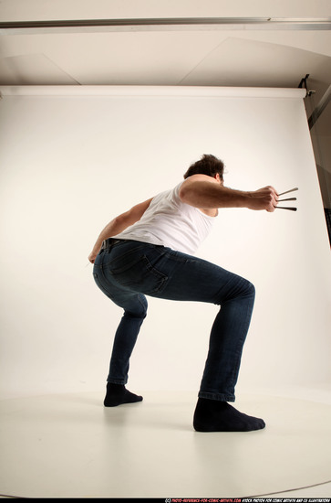 Man Adult Average White Fist fight Kneeling poses Casual