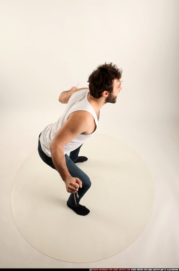 Man Adult Average White Fist fight Kneeling poses Casual