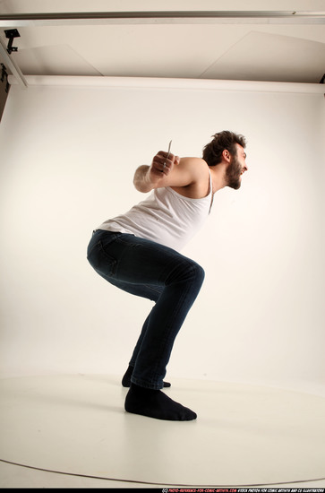 Man Adult Average White Fist fight Kneeling poses Casual