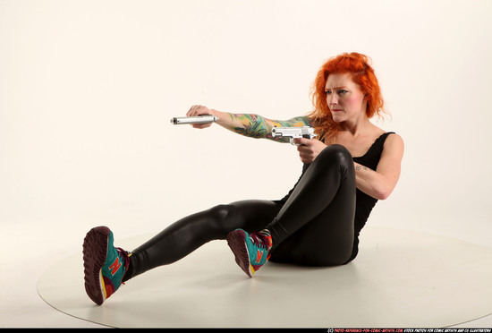 Woman Adult Athletic White Fighting with gun Laying poses Casual