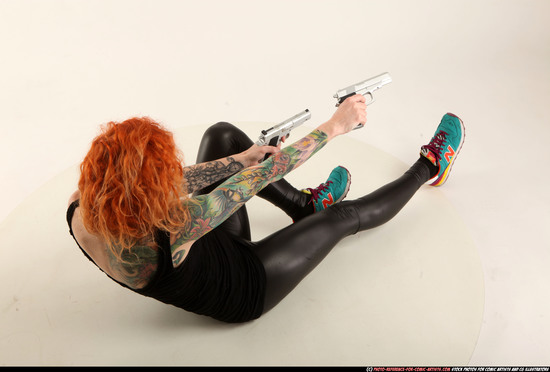 Woman Adult Athletic White Fighting with gun Laying poses Casual