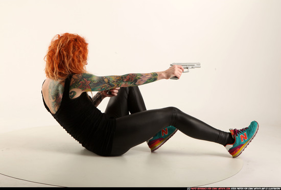 Woman Adult Athletic White Fighting with gun Laying poses Casual