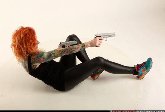 Woman Adult Athletic White Fighting with gun Laying poses Casual