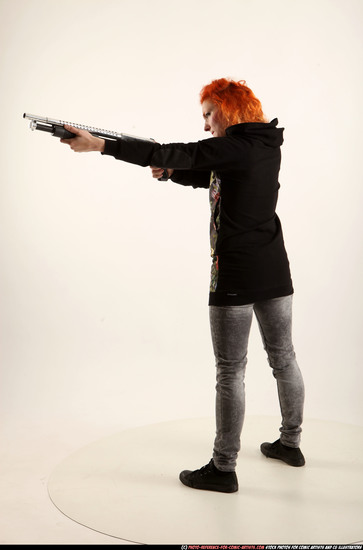 Woman Adult Athletic White Standing poses Casual Fighting with shotgun