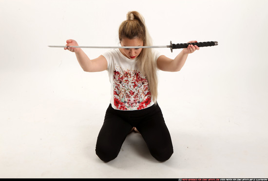 Woman Young Average Fighting with sword Kneeling poses Casual Asian