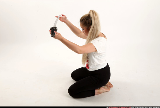 Woman Young Average Fighting with sword Kneeling poses Casual Asian