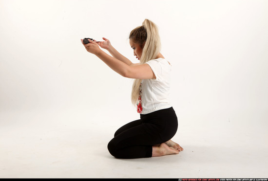 Woman Young Average Fighting with sword Kneeling poses Casual Asian