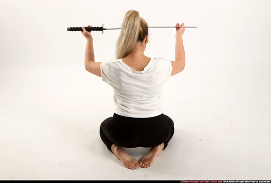 Woman Young Average Fighting with sword Kneeling poses Casual Asian