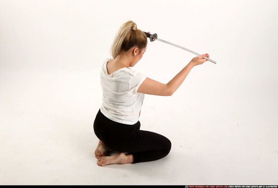 Woman Young Average Fighting with sword Kneeling poses Casual Asian