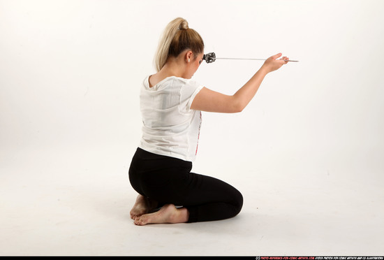 Woman Young Average Fighting with sword Kneeling poses Casual Asian