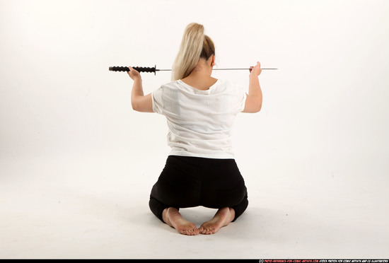 Woman Young Average Fighting with sword Kneeling poses Casual Asian