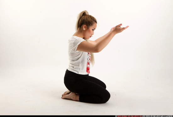 Woman Young Average Fighting with sword Kneeling poses Casual Asian