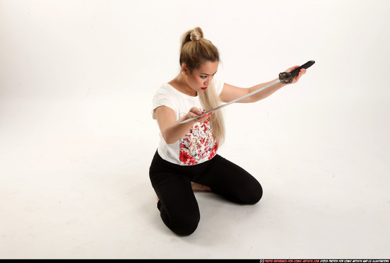 Woman Young Average Fighting with sword Kneeling poses Casual Asian