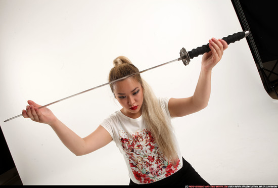 Woman Young Average Fighting with sword Kneeling poses Casual Asian