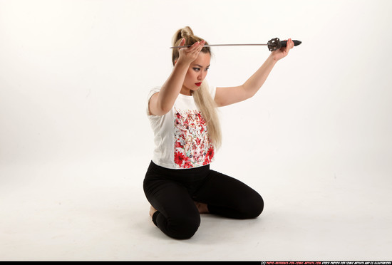 Woman Young Average Fighting with sword Kneeling poses Casual Asian