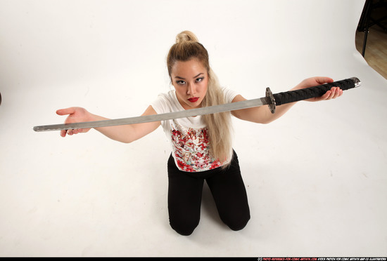 Woman Young Average Fighting with sword Kneeling poses Casual Asian