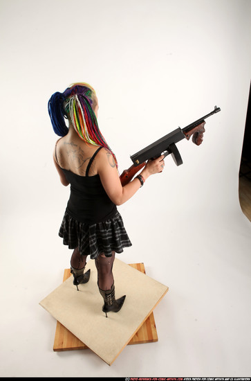 Woman Young Average White Fighting with submachine gun Standing poses Casual