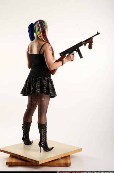 Woman Young Average White Fighting with submachine gun Standing poses Casual