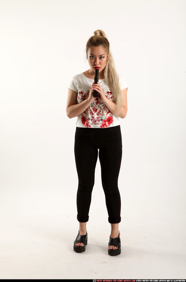 Woman Young Average Fighting with gun Standing poses Casual Asian