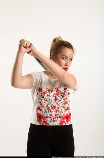 Woman Young Average Standing poses Casual Asian Fighting with bat