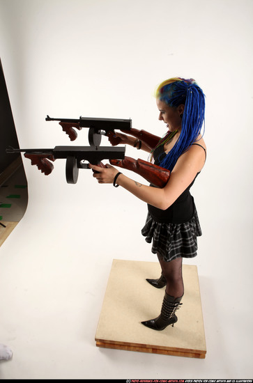 Woman Young Average White Fighting with submachine gun Standing poses Casual