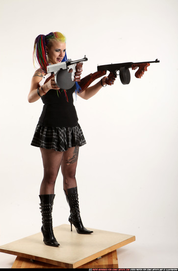 Woman Young Average White Fighting with submachine gun Standing poses Casual