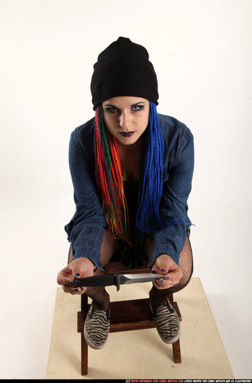 Woman Young Average White Fighting with knife Sitting poses Casual