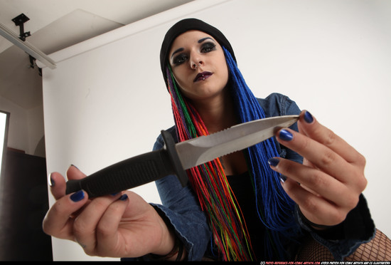 Woman Young Average White Fighting with knife Sitting poses Casual