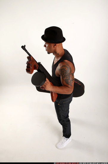 Man Adult Athletic Black Fighting with submachine gun Standing poses Casual