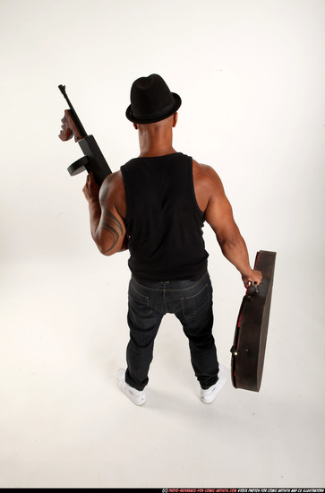 Man Adult Athletic Black Fighting with submachine gun Standing poses Casual