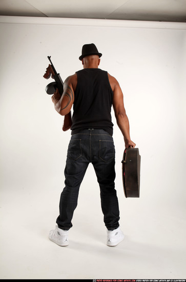 Man Adult Athletic Black Fighting with submachine gun Standing poses Casual