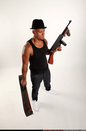 Man Adult Athletic Black Fighting with submachine gun Standing poses Casual