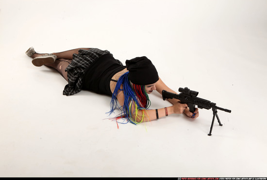 Woman Young Average White Fighting with submachine gun Laying poses Casual