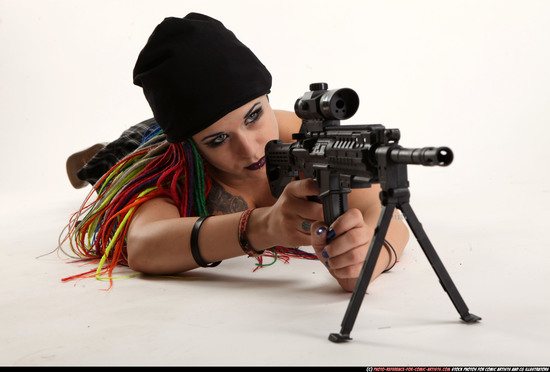 Woman Young Average White Fighting with submachine gun Laying poses Casual