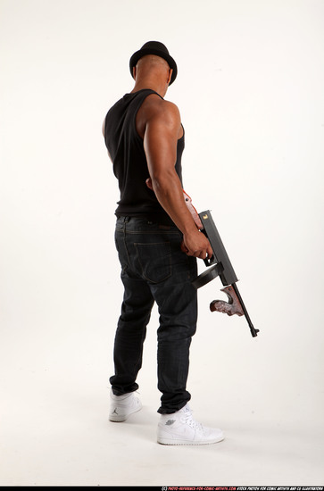 Man Adult Athletic Black Fighting with submachine gun Standing poses Casual